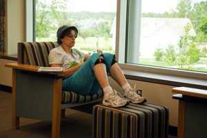 Woman Reading a Book in Library